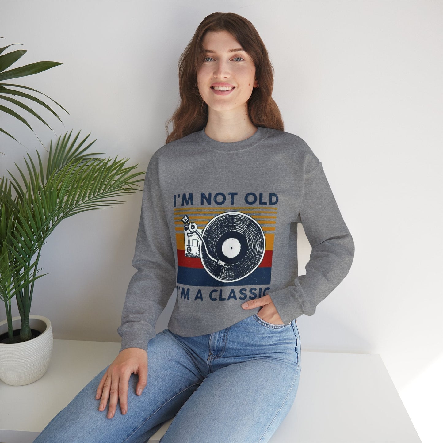 Unisex crewneck sweatshirt with "I'm Not Old I'm a Classic" design, featuring a vintage-inspired graphic on a cozy, classic-fit garment.