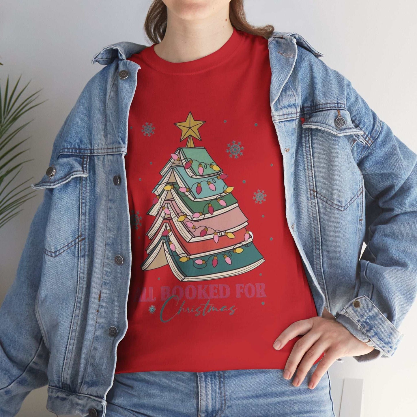 Red "All Booked For Christmas" shirt with Christmas book tree design, perfect gift for book lovers and librarians.
