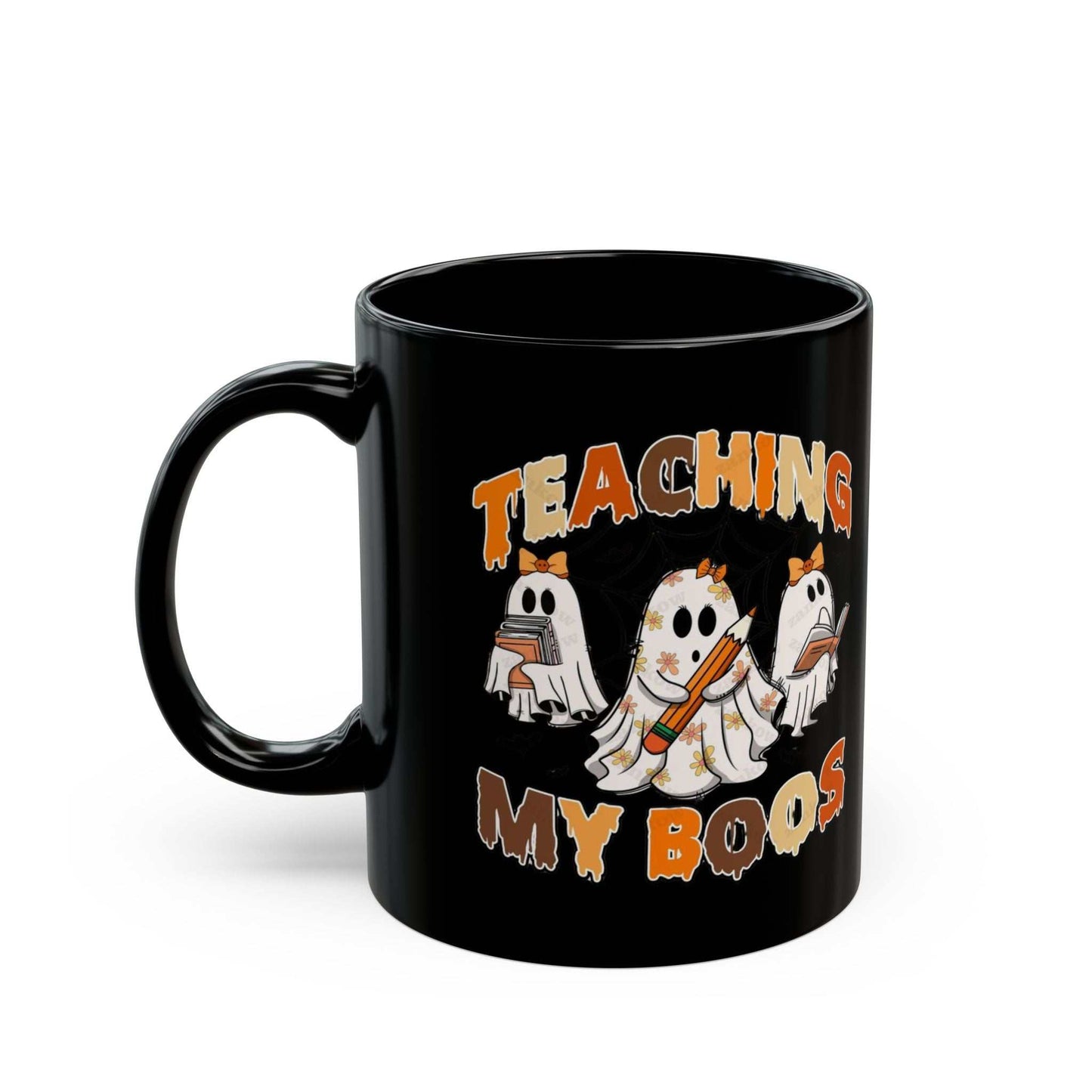Black ceramic mug with ghost and "Teaching My Boos" design, perfect Halloween gift for teachers.