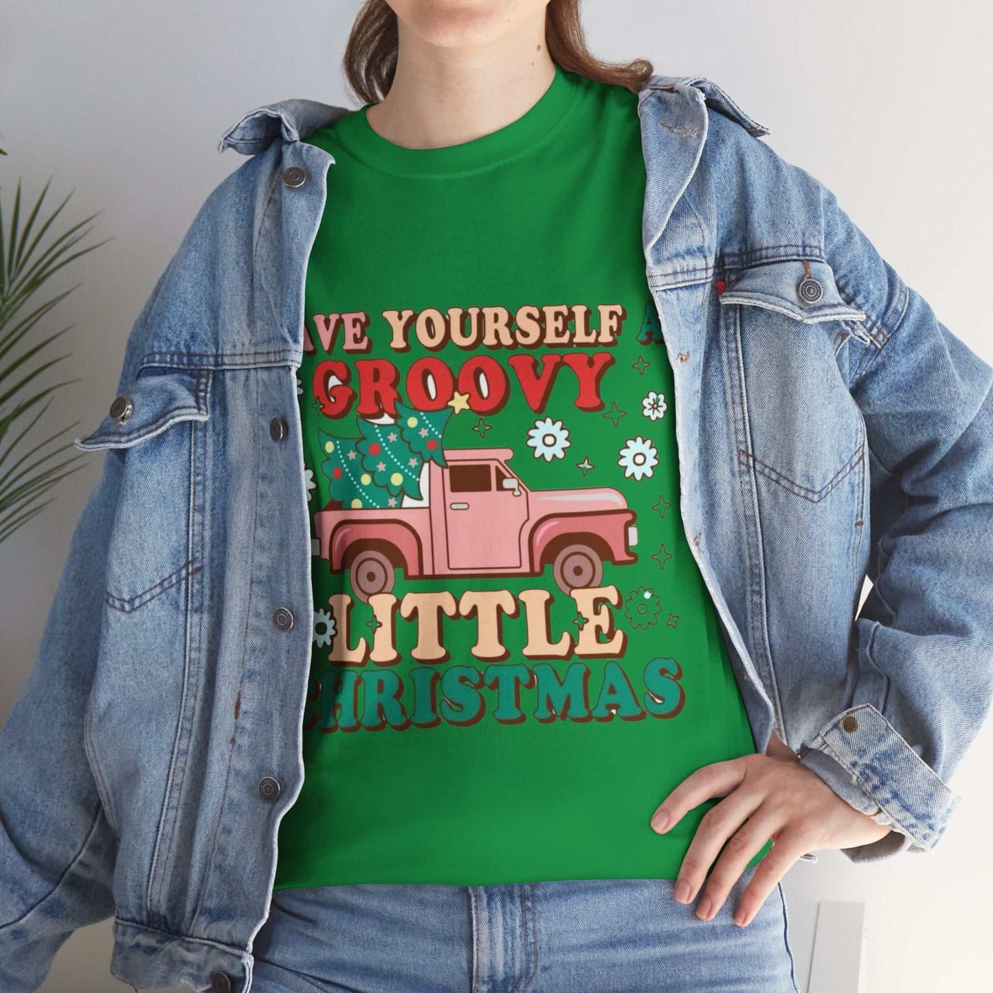 Retro Christmas shirt with groovy festive design and colorful truck graphic.