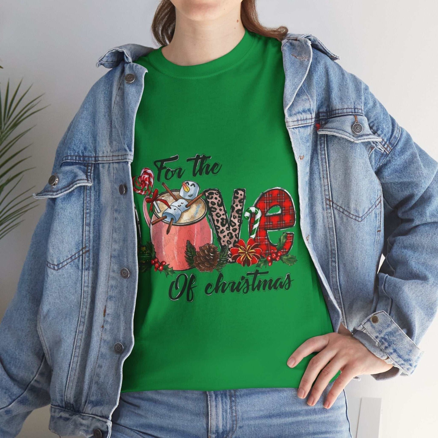 Green Christmas shirt with "For The Love Of Christmas" design, worn under a denim jacket.
