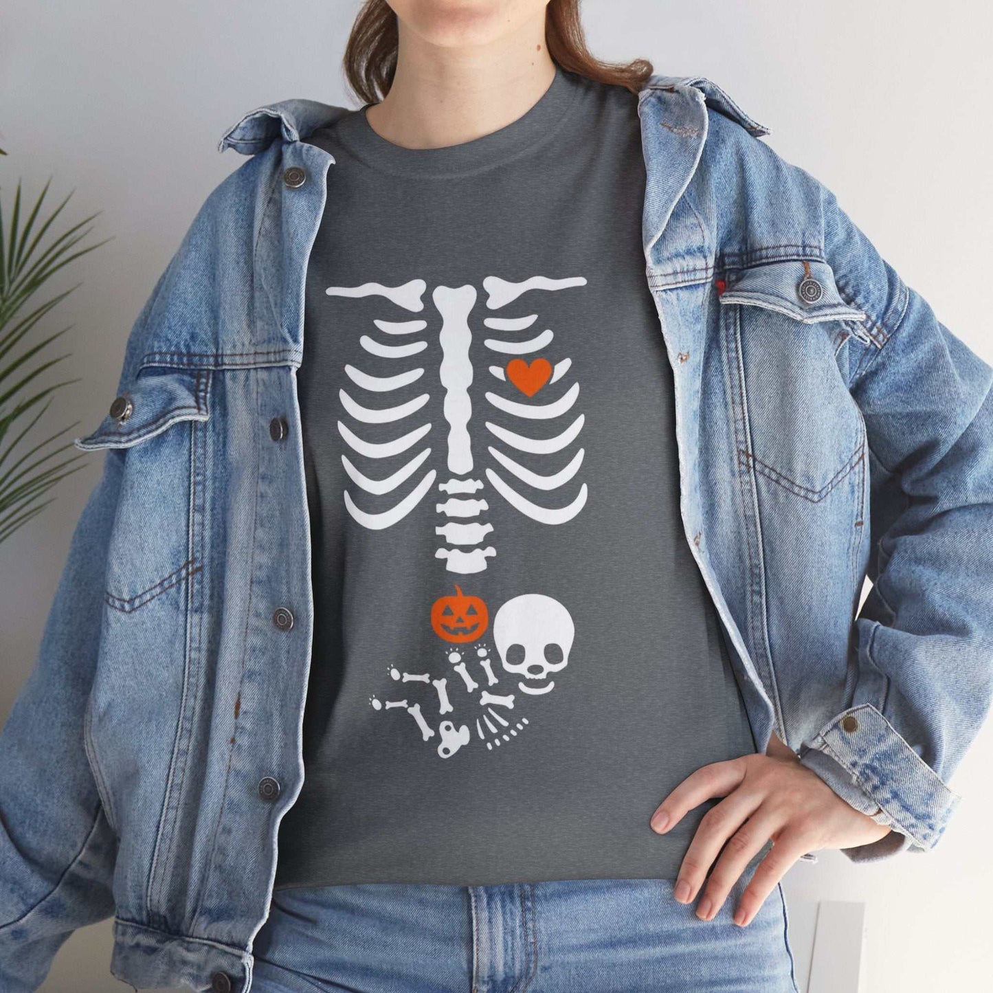 Halloween maternity shirt with skeleton and pumpkin design for pregnancy reveal.