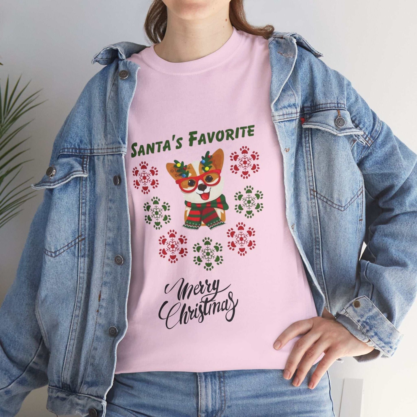 Cute pink Christmas dog shirt with "Santa's Favorite" text, festive paw print design, ideal Christmas gift.