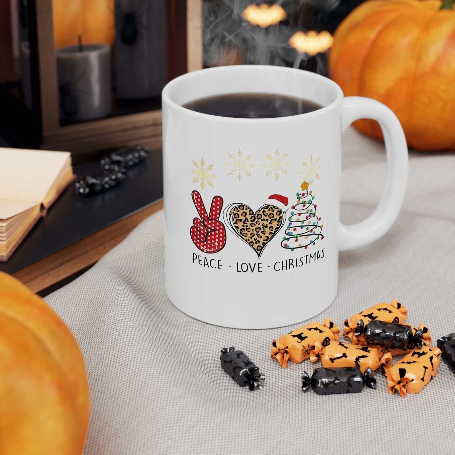 Peace Love Christmas Santa mug with festive design on a cozy table setting.