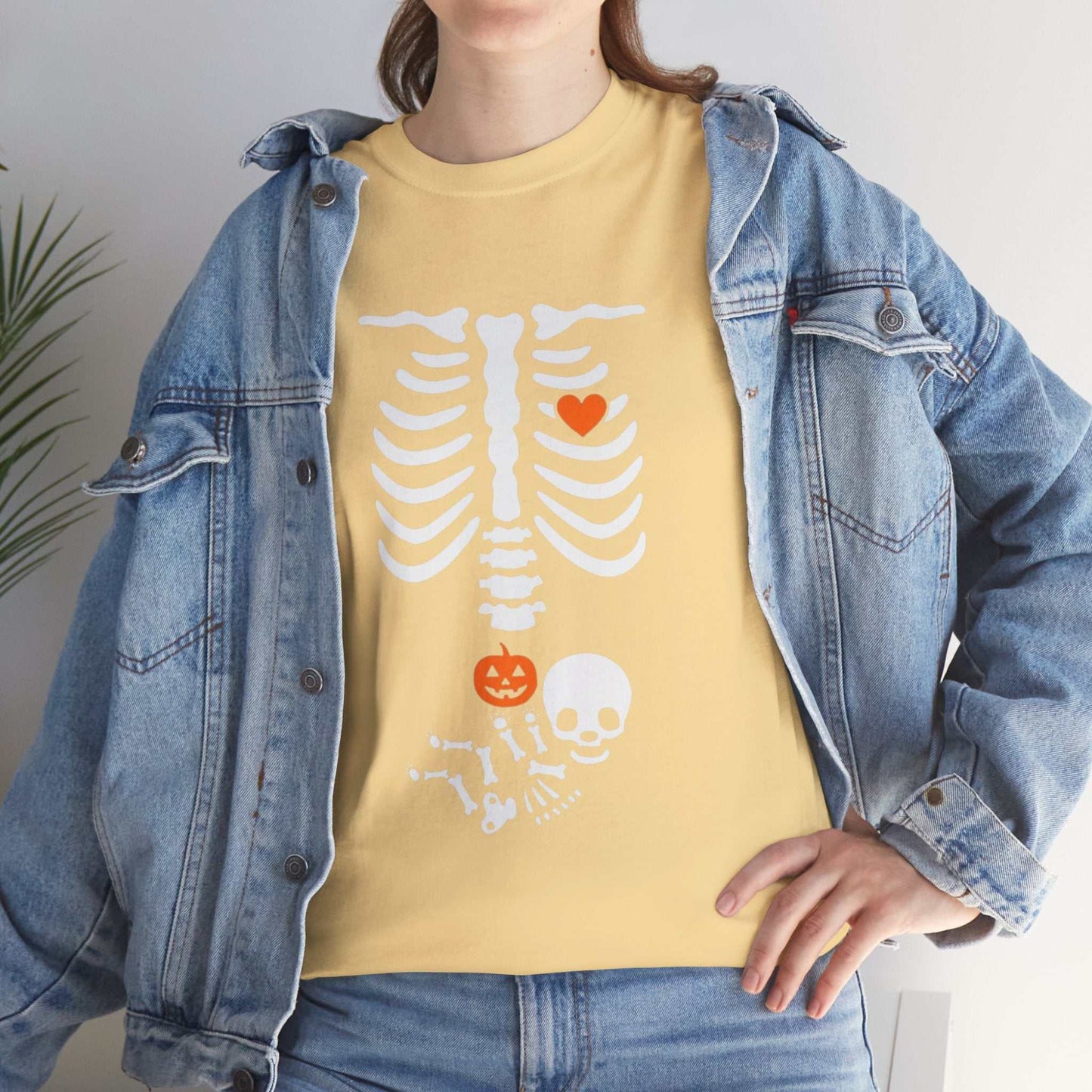 Halloween maternity shirt with skeleton and pumpkin design for pregnancy announcement.
