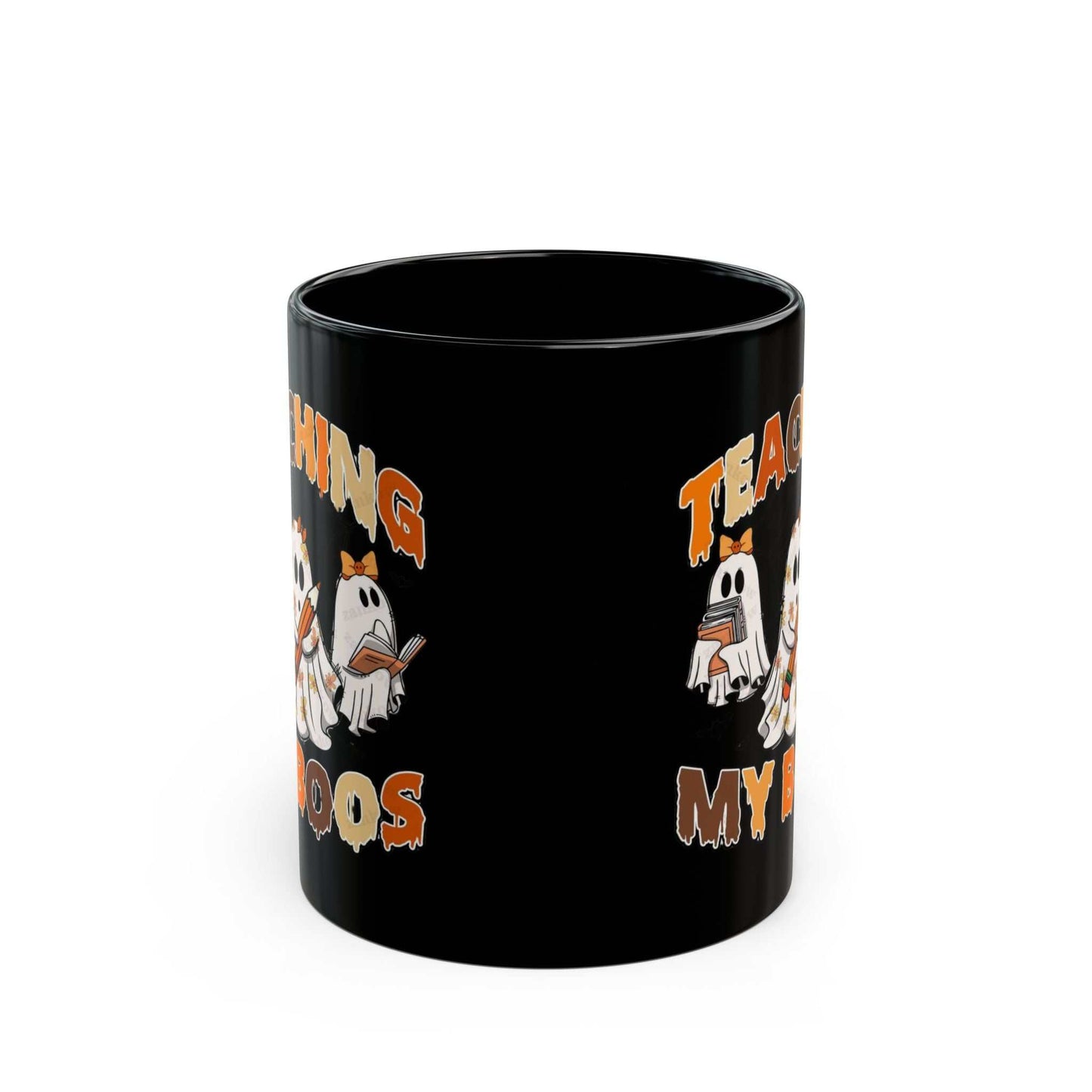 Black ceramic mug with "Teaching My Boos" Halloween ghost design, ideal for teachers.