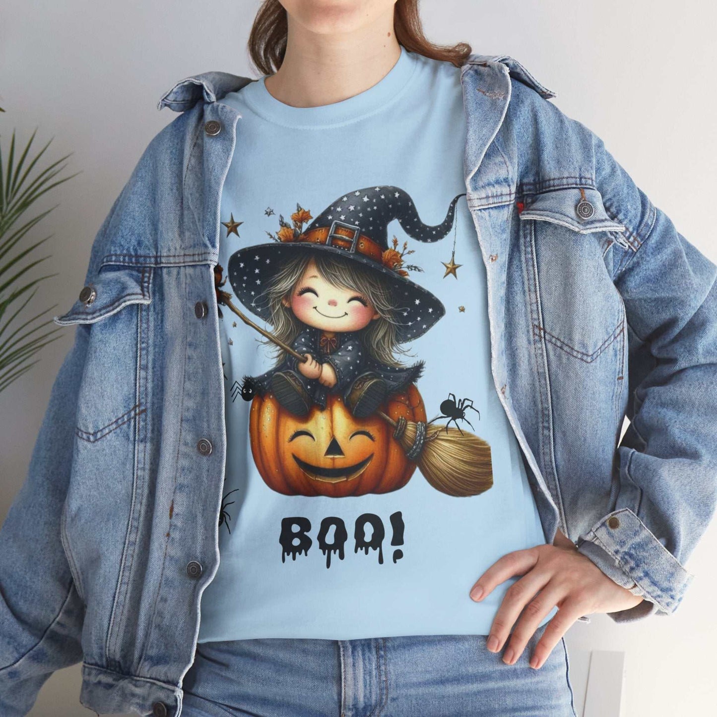Halloween girl shirt with cute ghost design featuring a witch in a pumpkin, unisex heavy cotton tee.