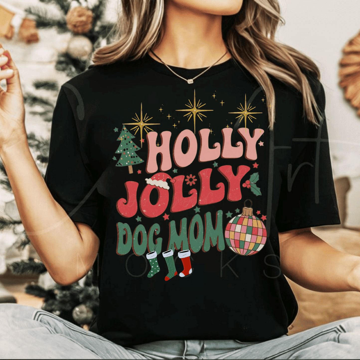 Retro Christmas shirt with "Holly Jolly Dog Mom" design and vintage holiday graphics.