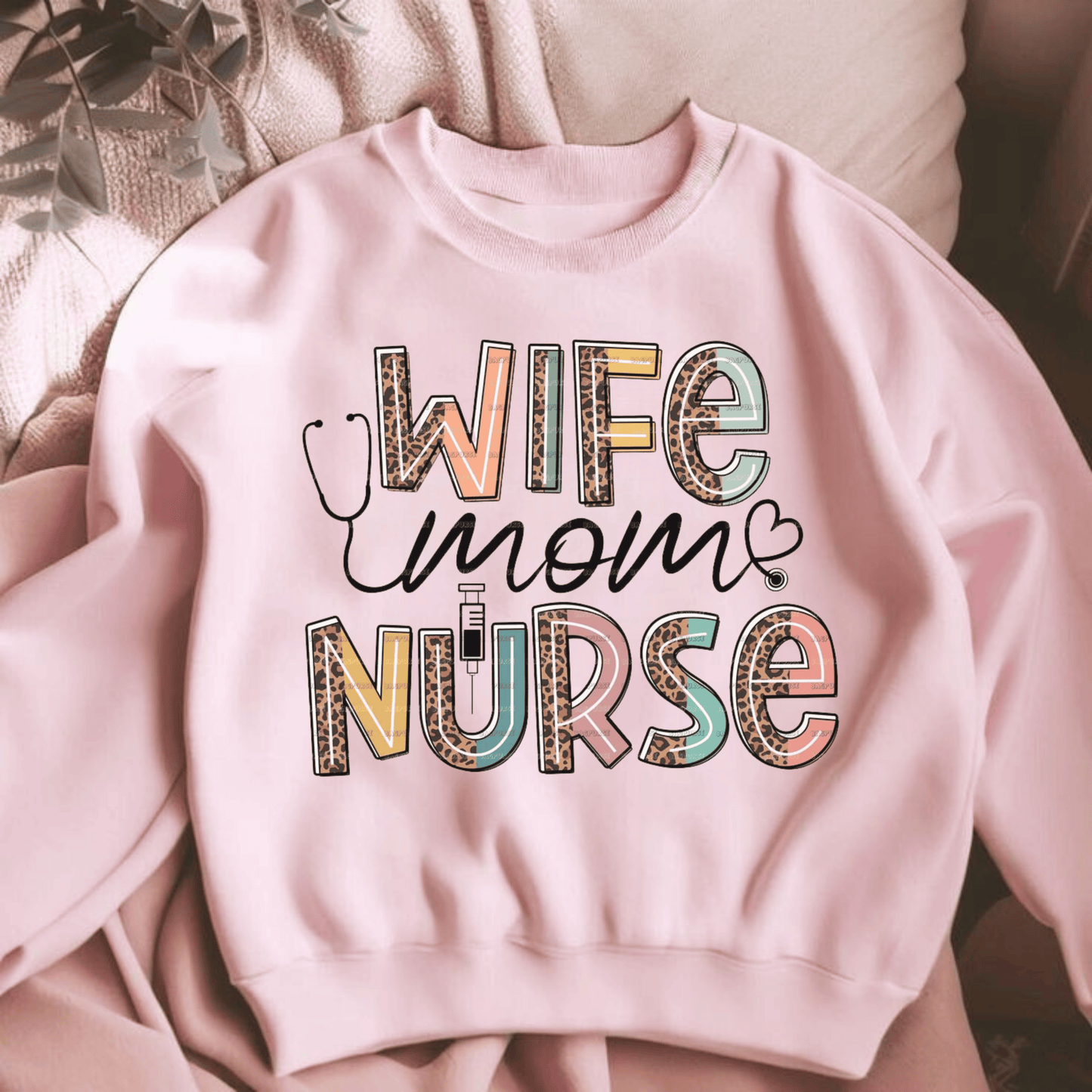 Celebrate hWife Mom Nurse Sweatshirter strength with the Wife Mom Nurse Sweatshirt. Soft, durable & heartfelt. A perfect gift for the healthcare hero in your life.