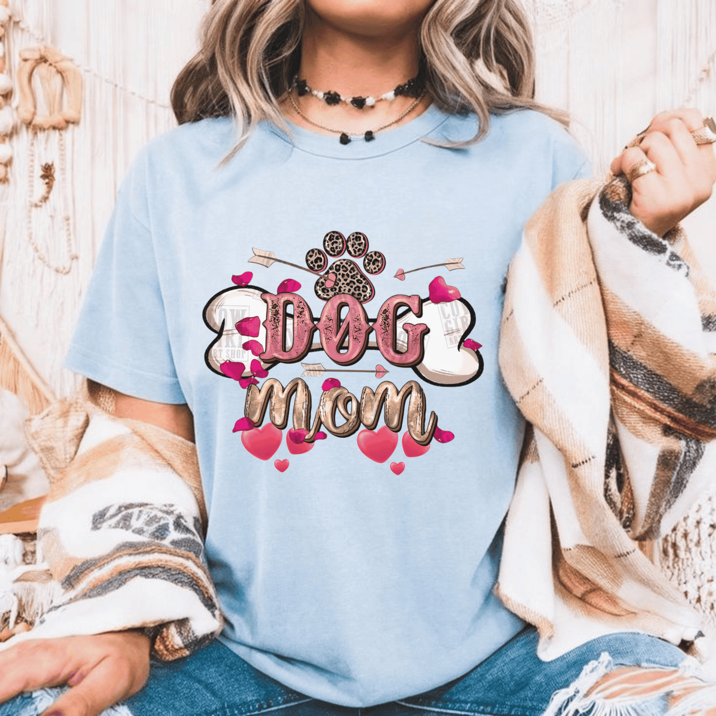 Dog Mom Valentine T-Shirt for dog lovers, perfect Valentine gift, woman wearing light blue shirt with paw print and heart design.
