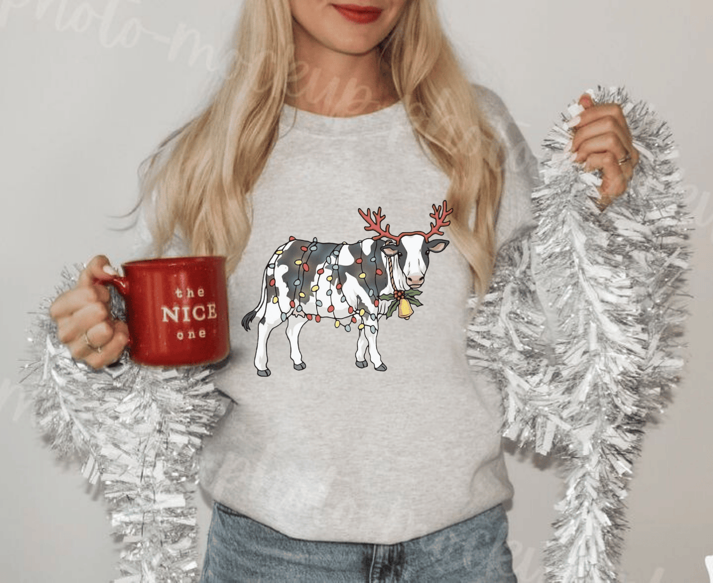 Cute cow Christmas lights sweatshirt for animal lovers.