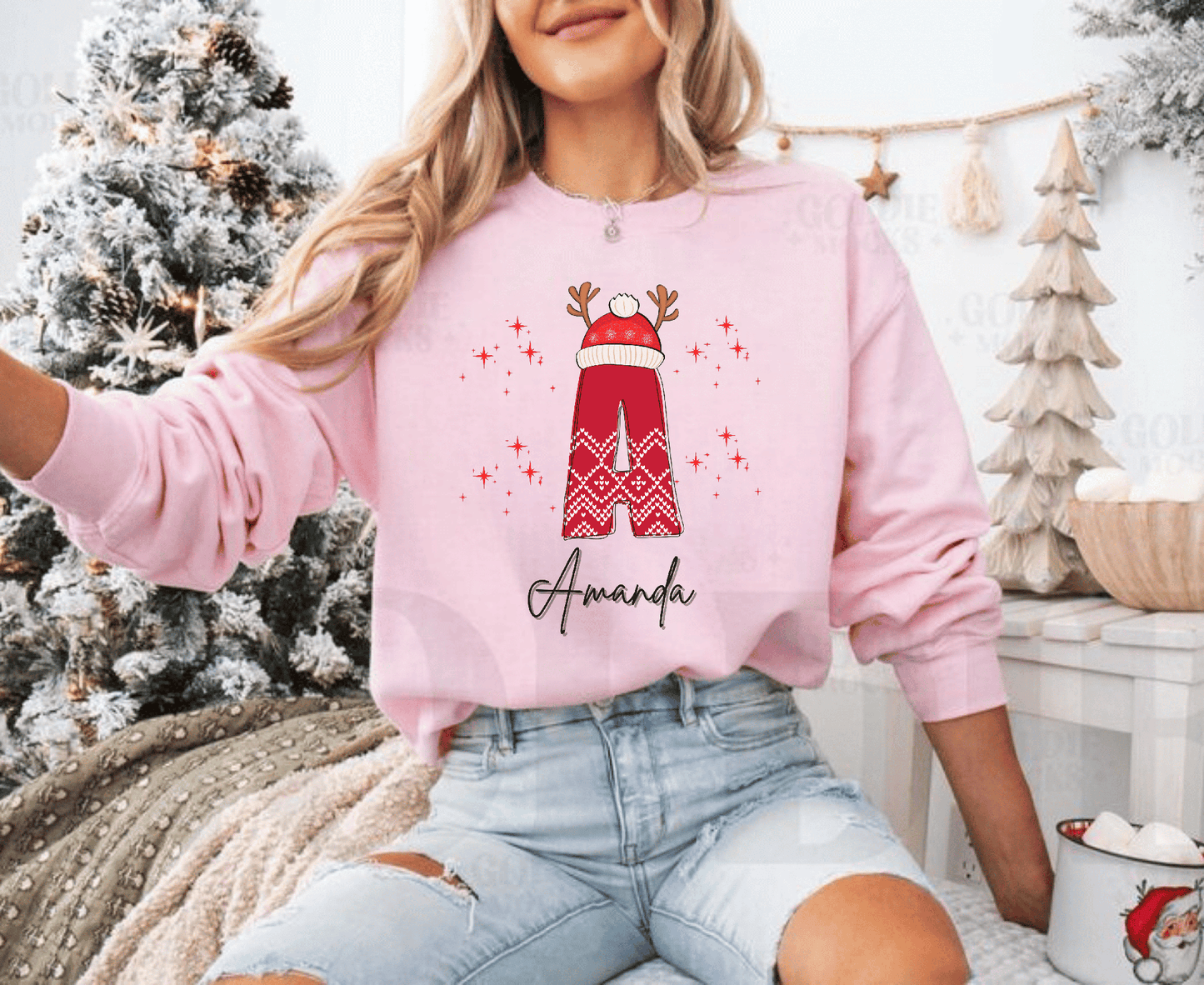 Cozy pink Christmas sweatshirt with personalized name design
