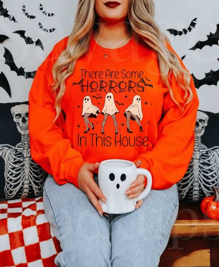 Funny Halloween Sweatshirt featuring ghost design and "There's Some Horrors in This House" text.