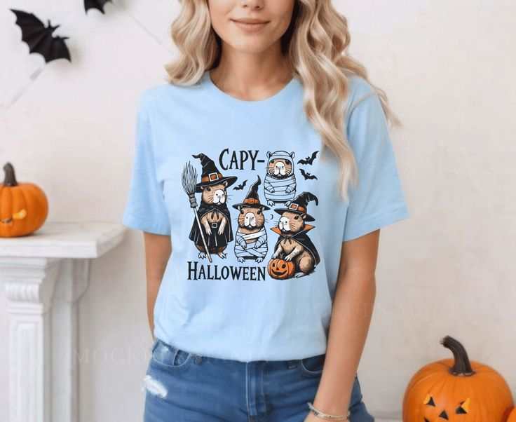 Halloween Capybara T-Shirt featuring spooky capybaras with pumpkins, perfect for Halloween fans and animal lovers who enjoy festive, quirky designs.