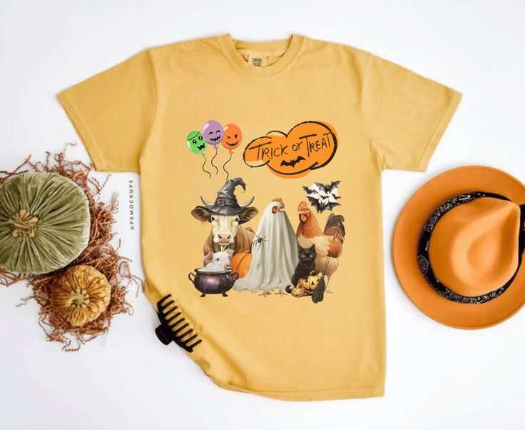Trick or Treat Halloween Shirt with festive animal design, spooky season gift, yellow tee.