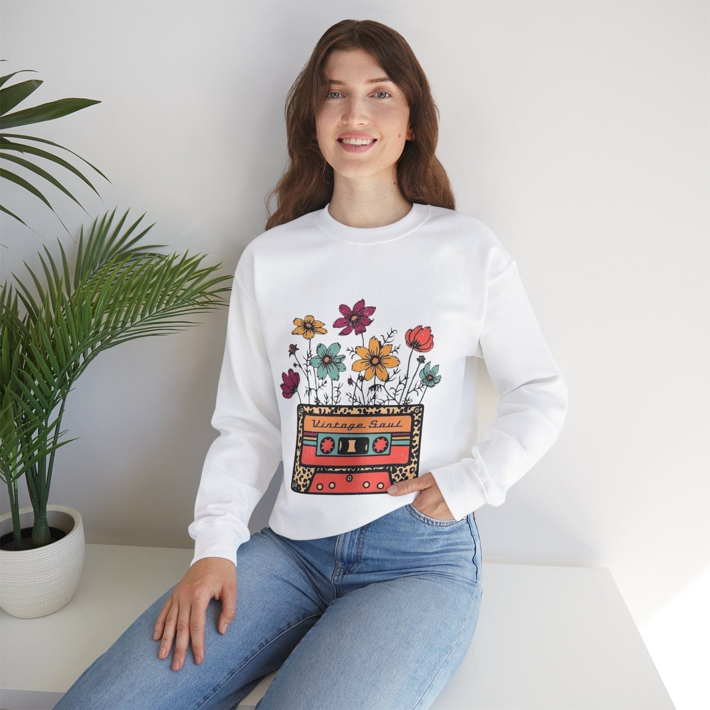 Unisex crewneck sweatshirt with floral cassette design, embodying vintage soul style.