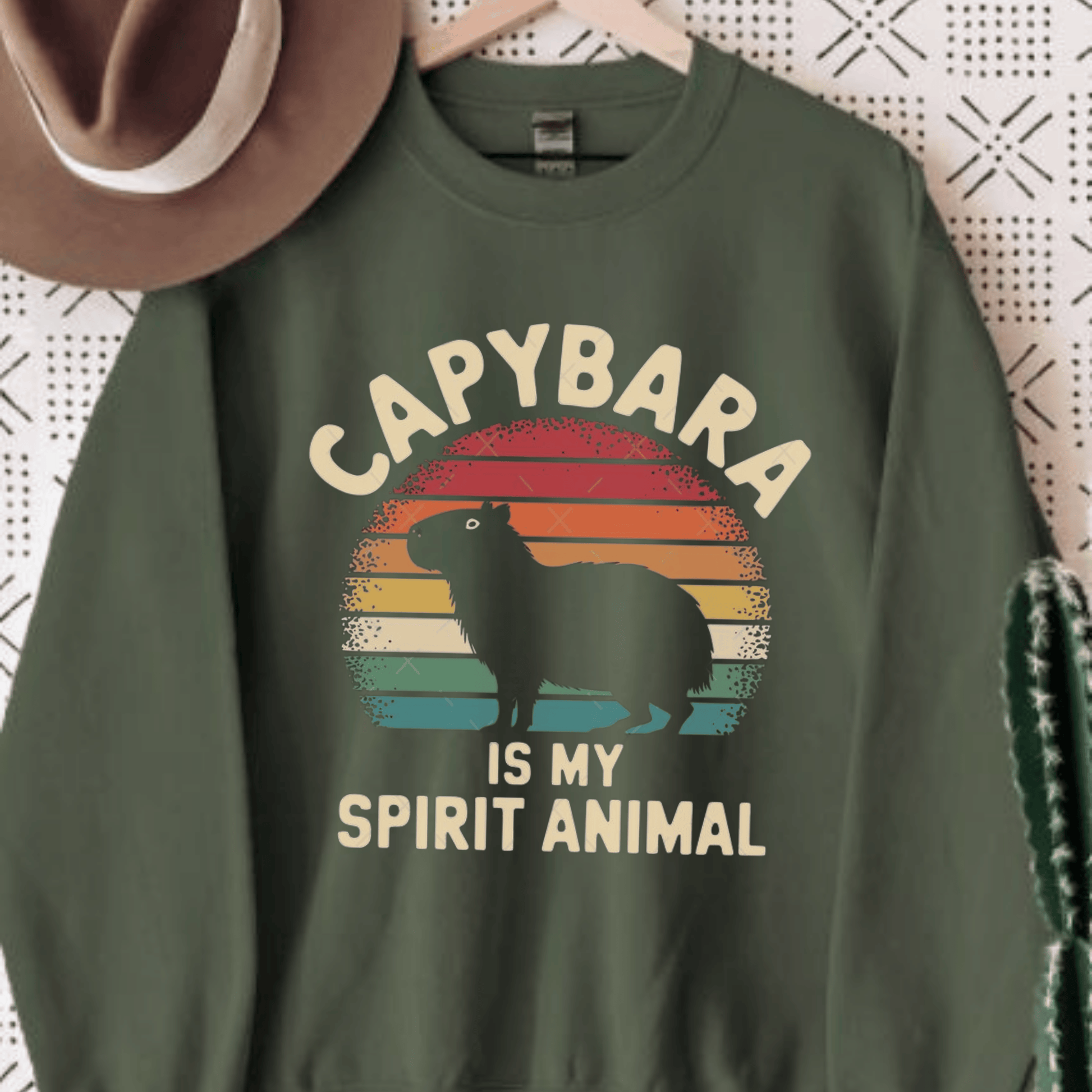 Capybara Spirit Animal Crewneck Sweatshirt featuring capybara design with retro sunset background, cozy and stylish for nature lovers.