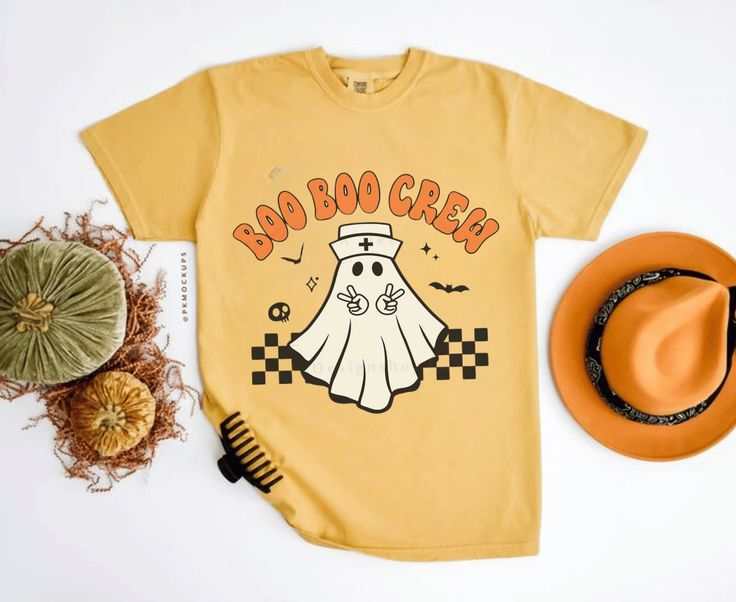 Boo Nurse Crew Halloween t-shirt with ghost nurse design, unisex heavy cotton, spooky fun attire.