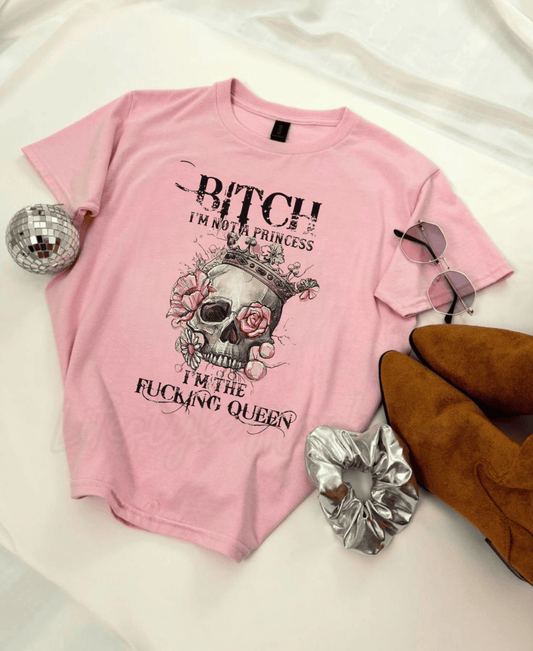 Queen Vibes unisex heavy cotton tee with bold skull and crown graphic on pink fabric.