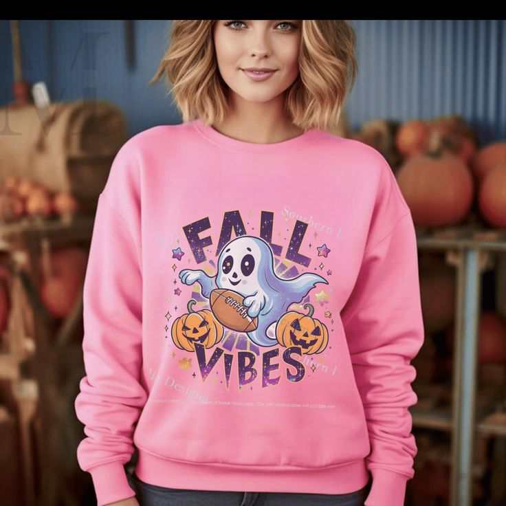 Unisex pink Fall Vibes sweatshirt with ghost and pumpkin design, perfect for Halloween and Thanksgiving.